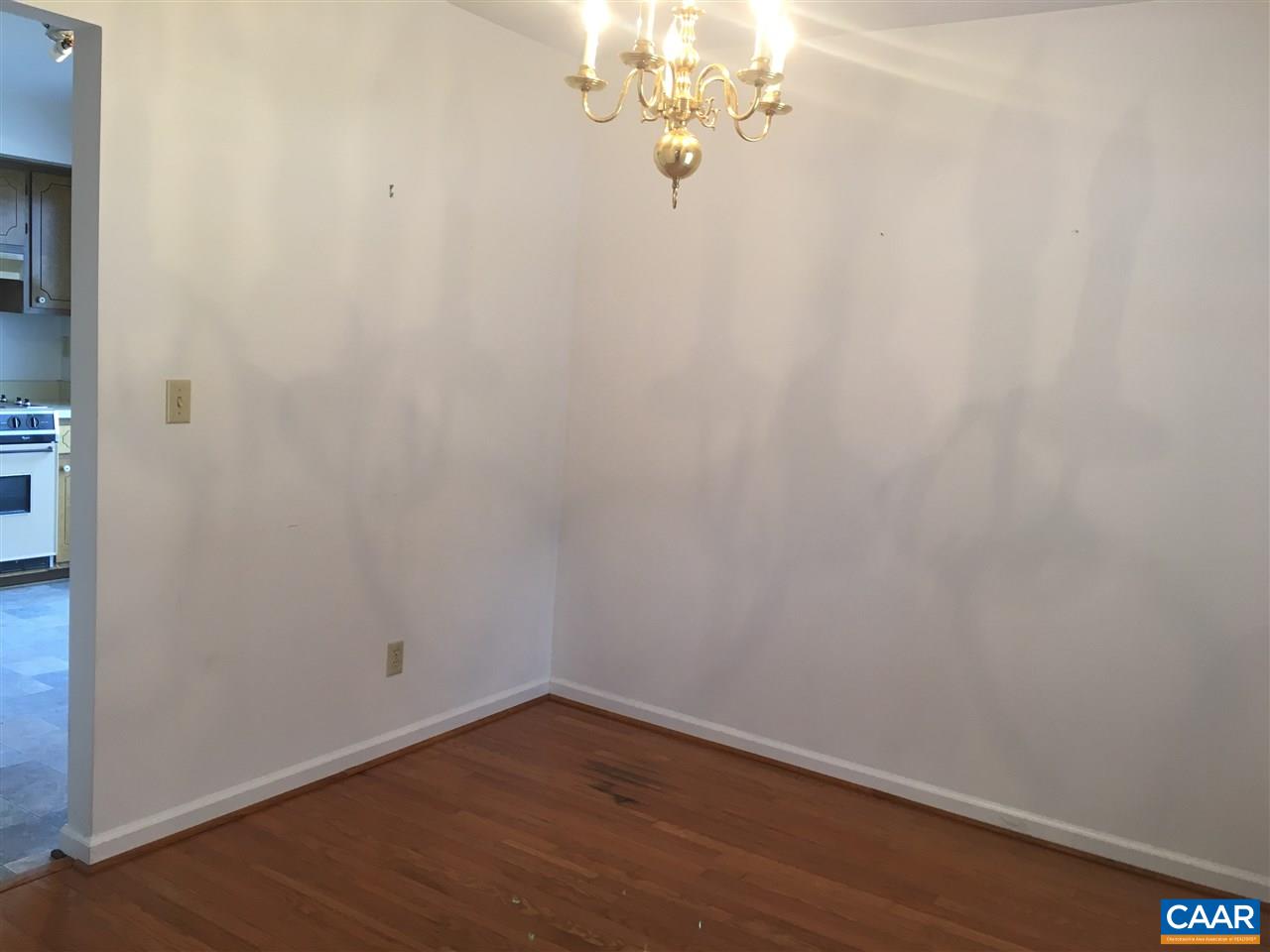 1650 Cool Spring Road Charlottesville, VA 22901 - Photo 3 of 24 a view of a room with wooden floor and a chandelier
