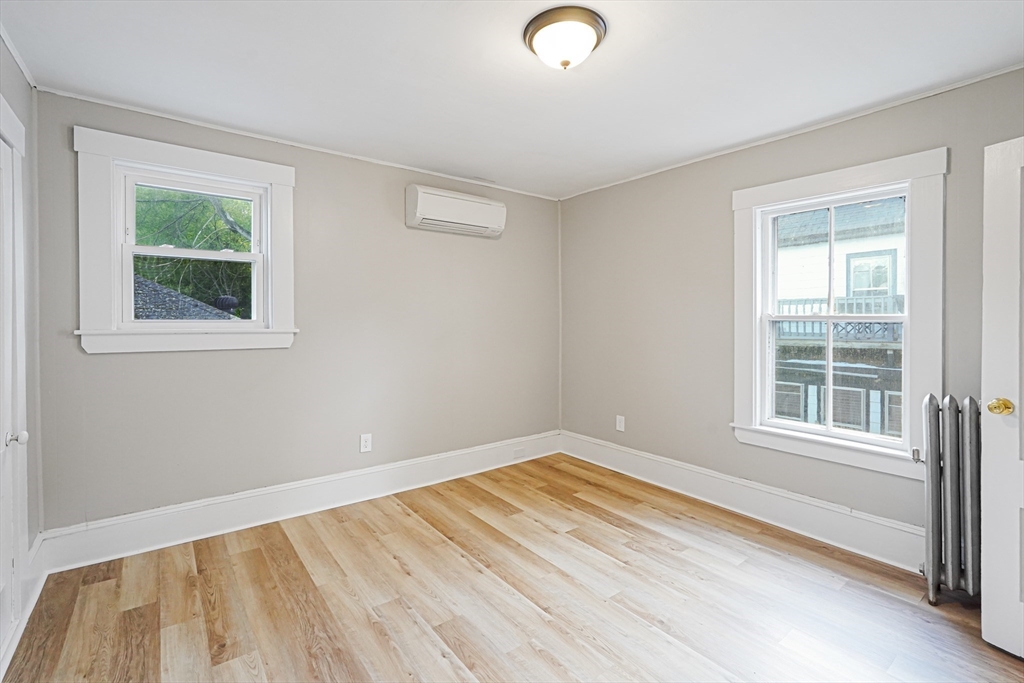 72 Main Street Pepperell, MA 01463 - Photo 12 of 26 an empty room with a window