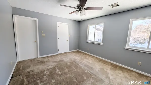 a view of empty room with windows