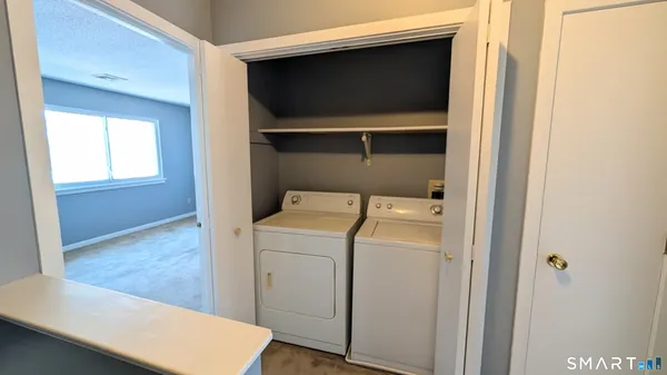 a utility room with dryer and washer
