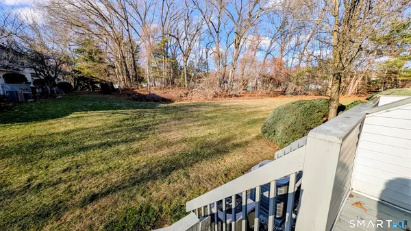 a view of yard with large trees