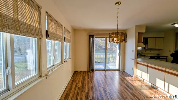 a view of a large kitchen with a large window