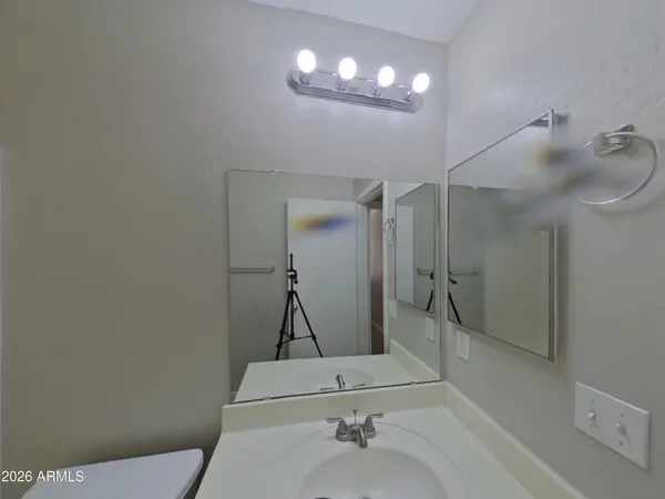 a bathroom with a toilet and bathtub