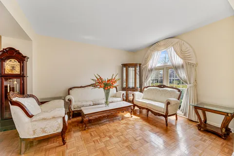 a living room with furniture and a rug