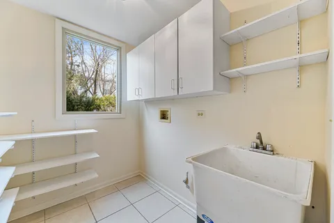 a bathroom with a bathtub and window