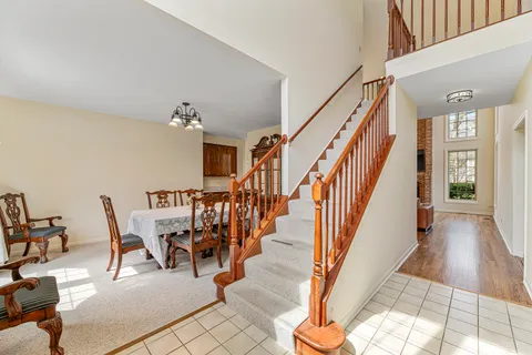 a view of entryway and hall with dining room