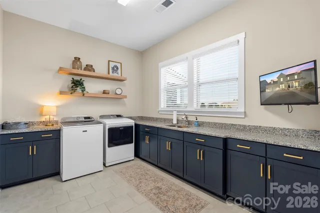 a kitchen with a sink stove and microwave