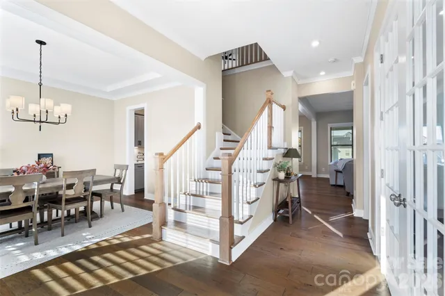 a view of an entryway with dining room and stairs