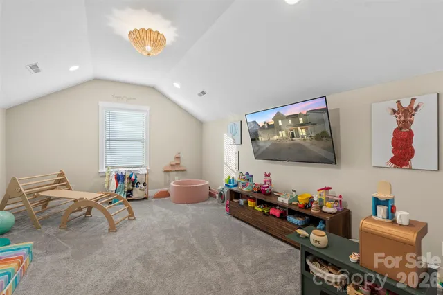 a room with furniture and a flat screen tv