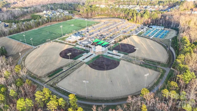 an aerial view of a house with outdoor space