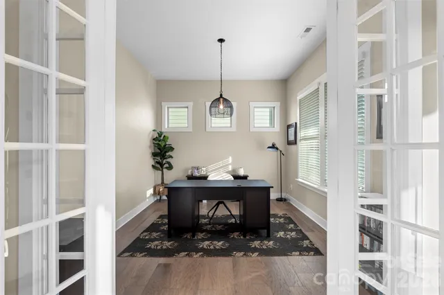 a view of a hallway with windows