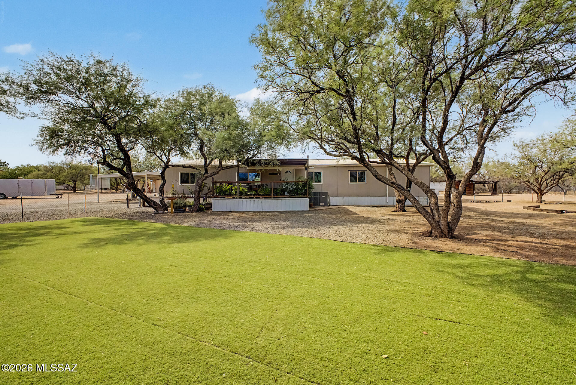 4231 East Pinal Street Tucson, AZ 85739 - Photo 1 of 36 a house view with swimming pool in front of it
