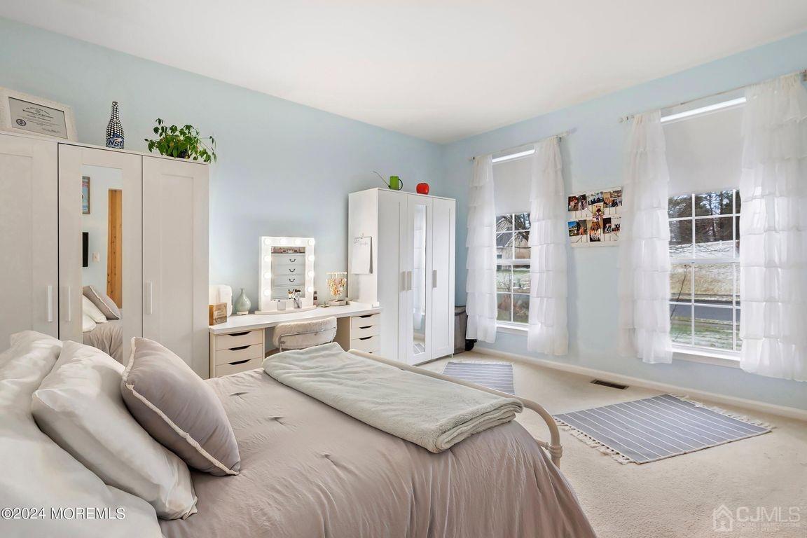 8 Williams Street Barnegat, NJ 08005 - Photo 12 of 64 a spacious bedroom with a bed and a couch