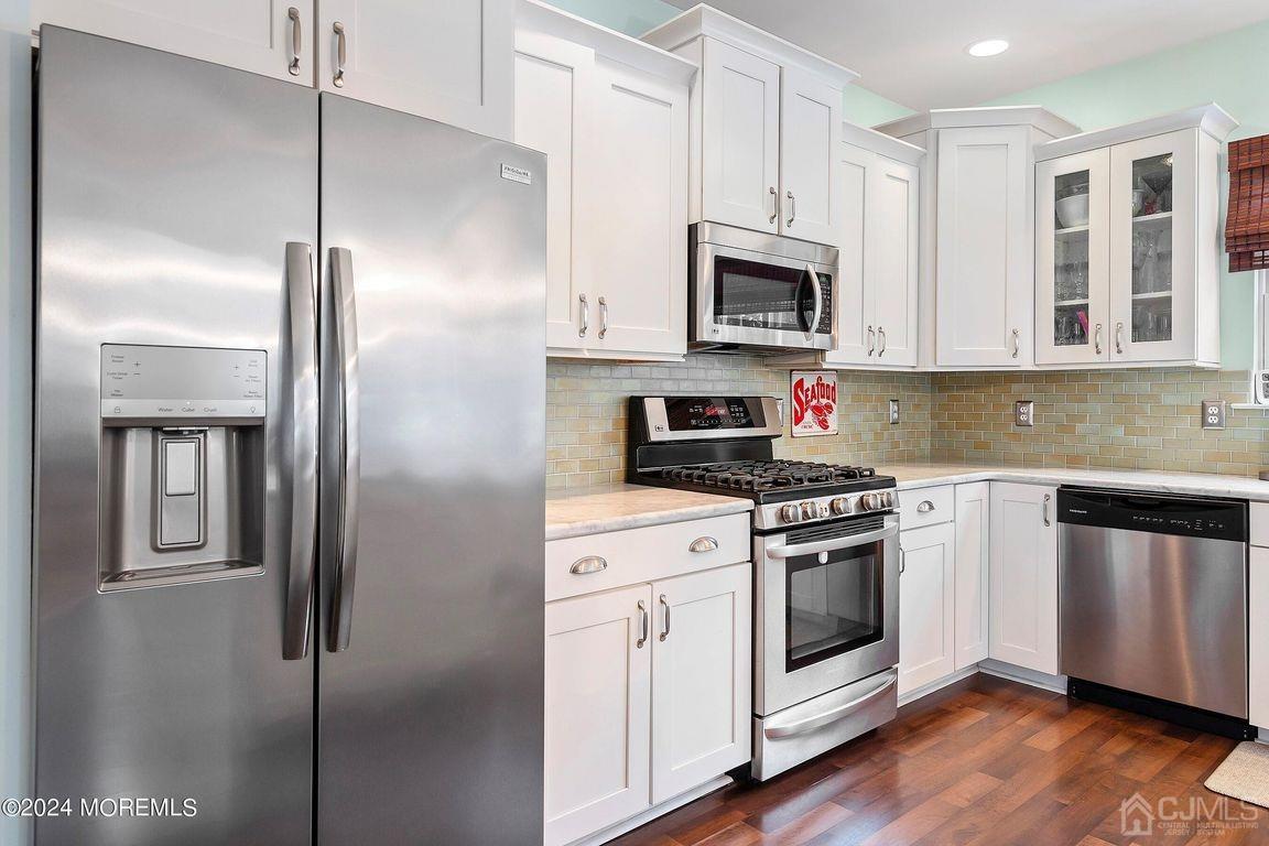 8 Williams Street Barnegat, NJ 08005 - Photo 22 of 64 a kitchen with cabinets stainless steel appliances and wooden floor