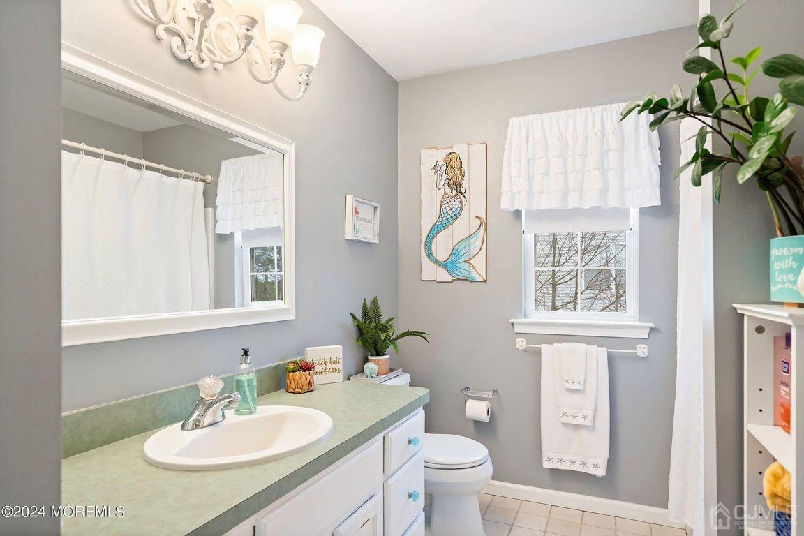 8 Williams Street Barnegat, NJ 08005 - Photo 33 of 64 a bathroom with a granite countertop sink and a mirror
