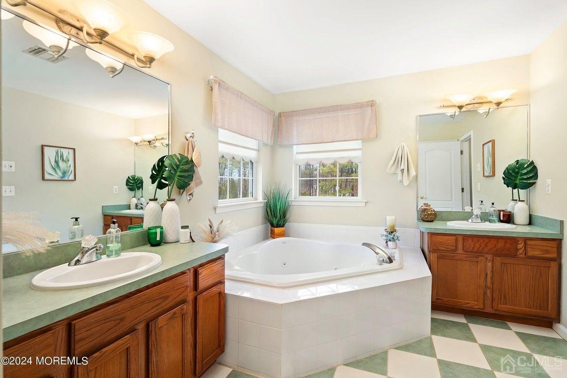 8 Williams Street Barnegat, NJ 08005 - Photo 41 of 64 a bathroom with a tub sink and mirror