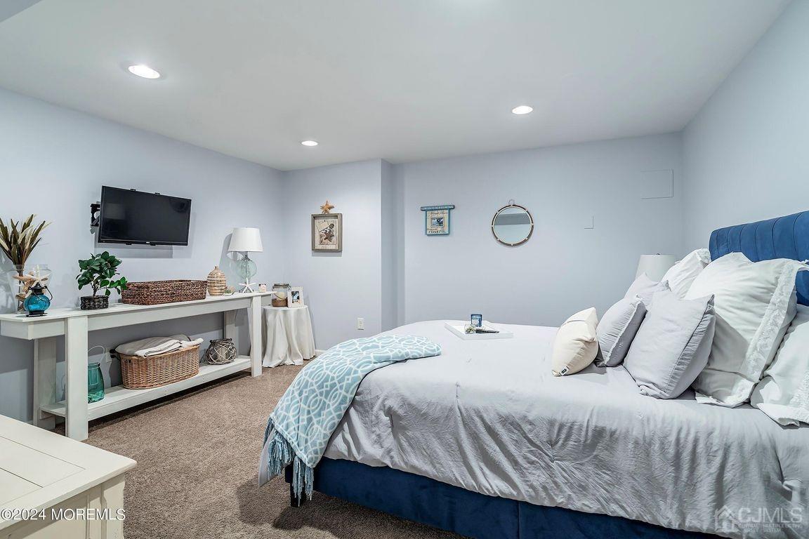 8 Williams Street Barnegat, NJ 08005 - Photo 47 of 64 a bedroom with a bed and a flat screen tv