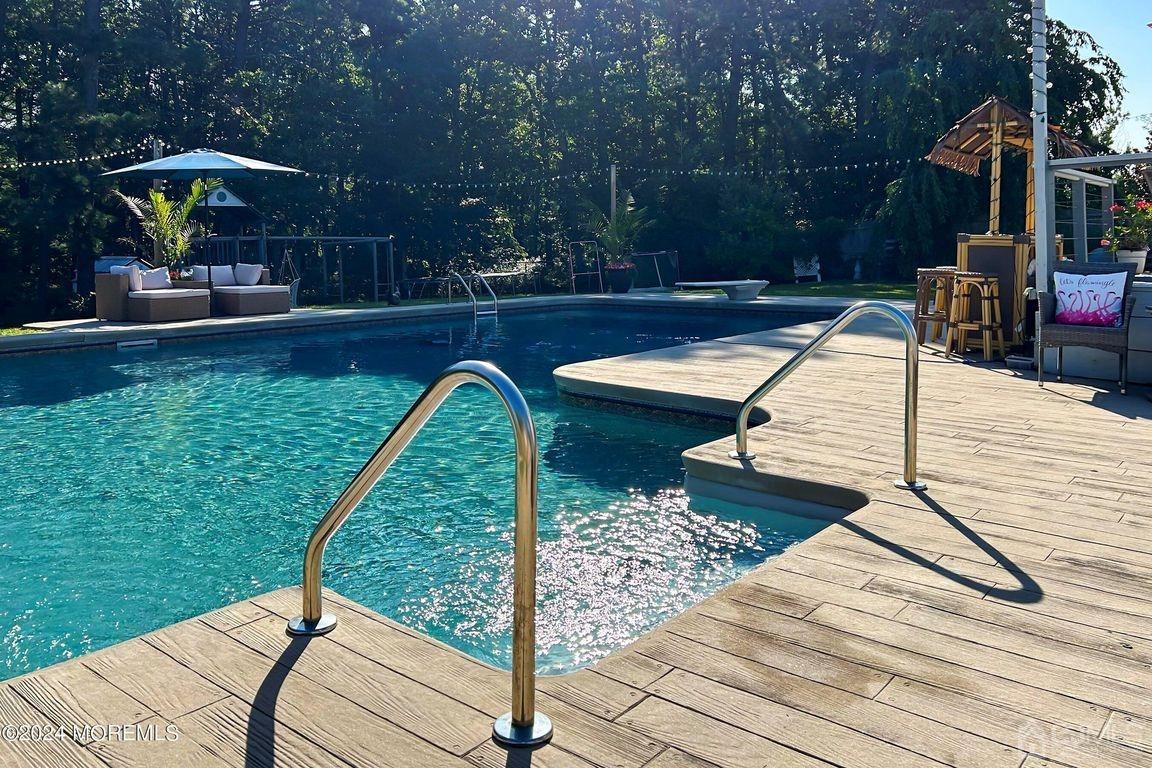 8 Williams Street Barnegat, NJ 08005 - Photo 51 of 64 a view of a patio with a table and chairs under an umbrella