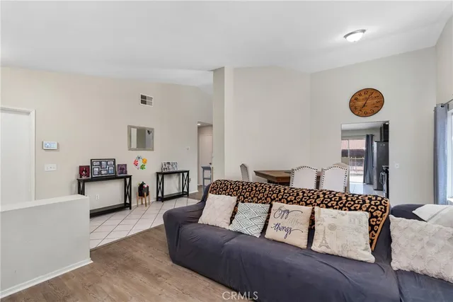 a living room with furniture and a table