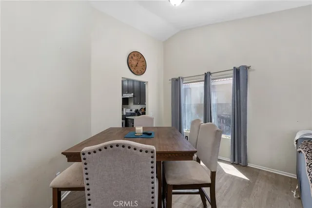 a view of a room with furniture and window