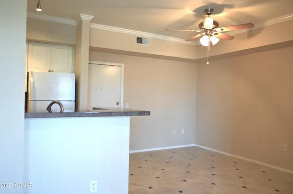 a view of a room with a mirror and a fan