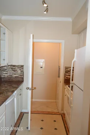 a bathroom with a shower and a sink