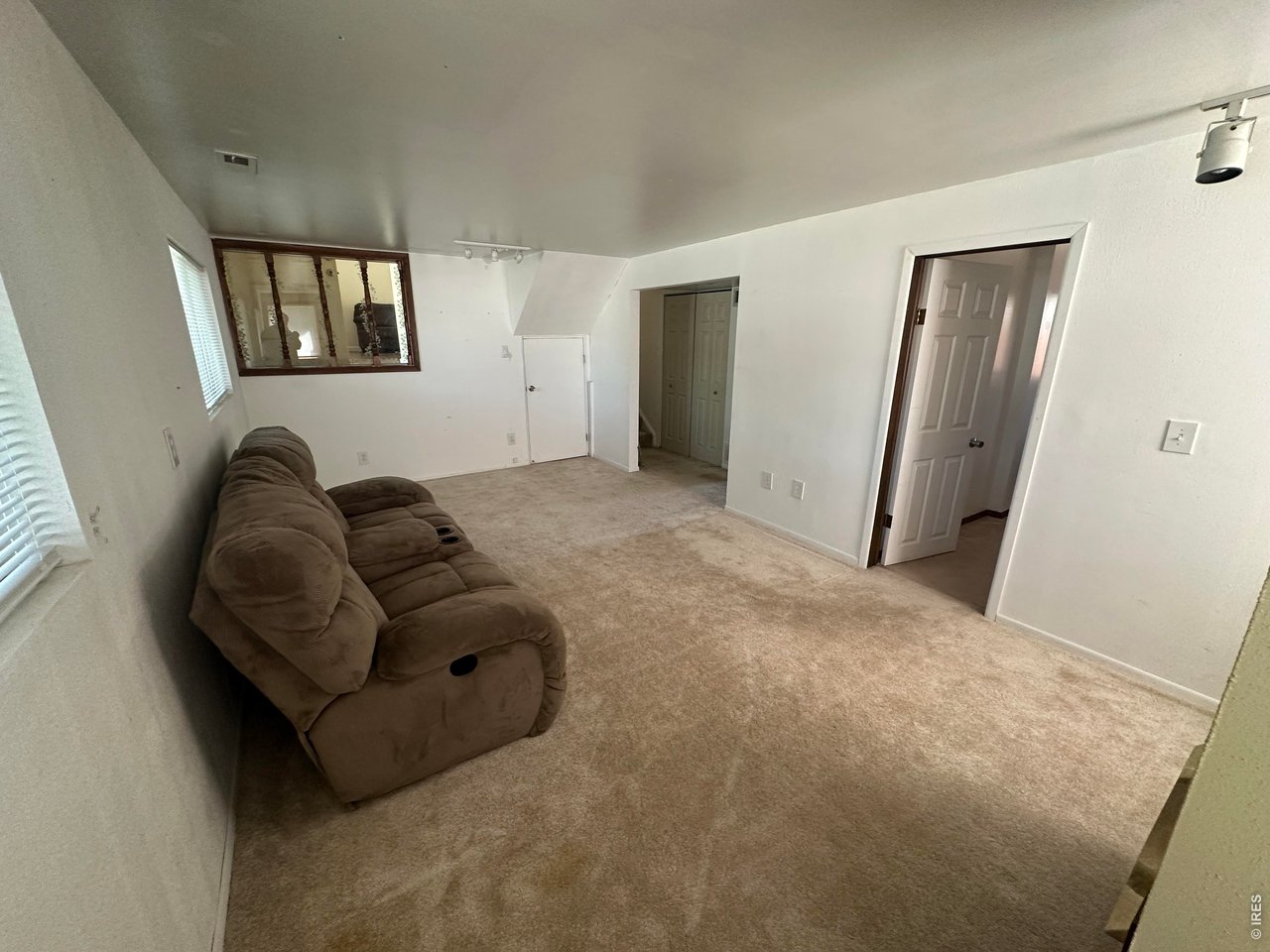268 Fifth Street Firestone, CO 80520 - Photo 21 of 25 a living room with furniture and a window