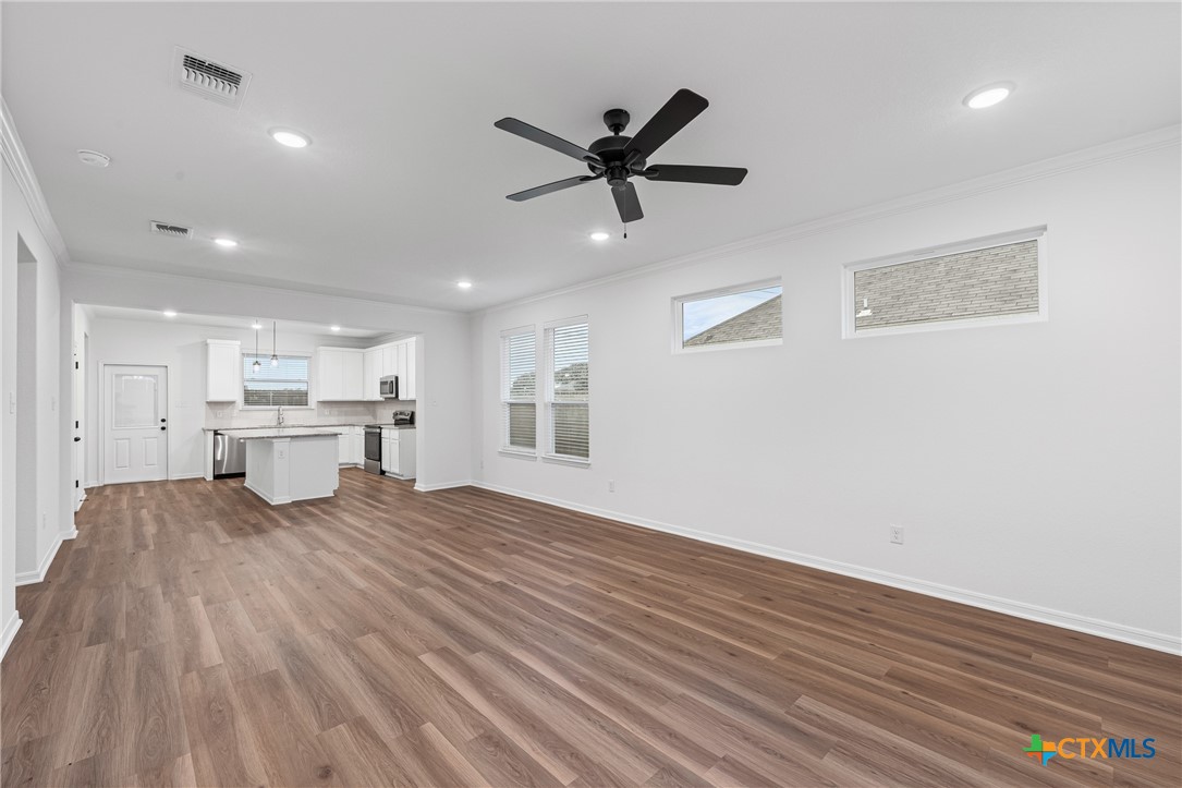 8011 Pineridge Way Temple, TX 76502 - Photo 12 of 32 a view of a kitchen with sink and wooden floor