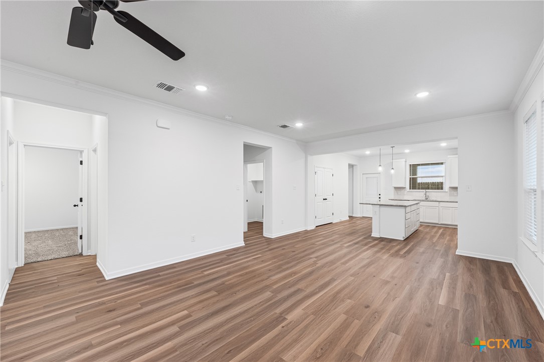 8011 Pineridge Way Temple, TX 76502 - Photo 13 of 32 a view of a kitchen with wooden floor and a sink