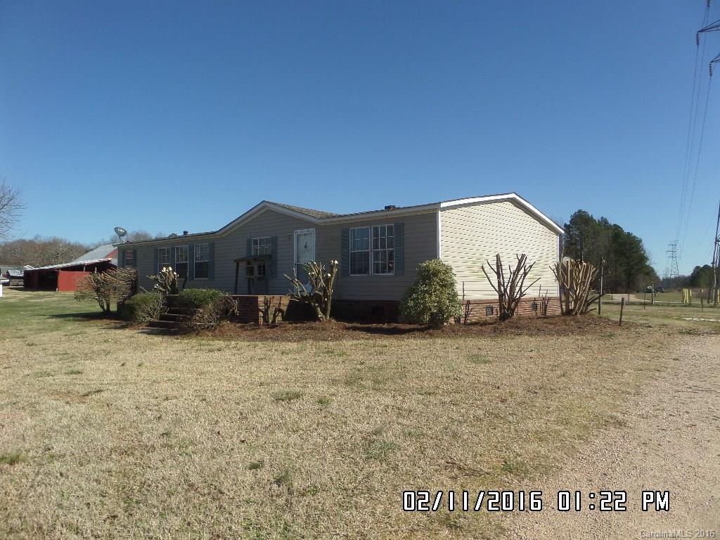 8480 Smith Road Kannapolis, NC 28081 - Photo 4 of 11 a view of a house with a yard
