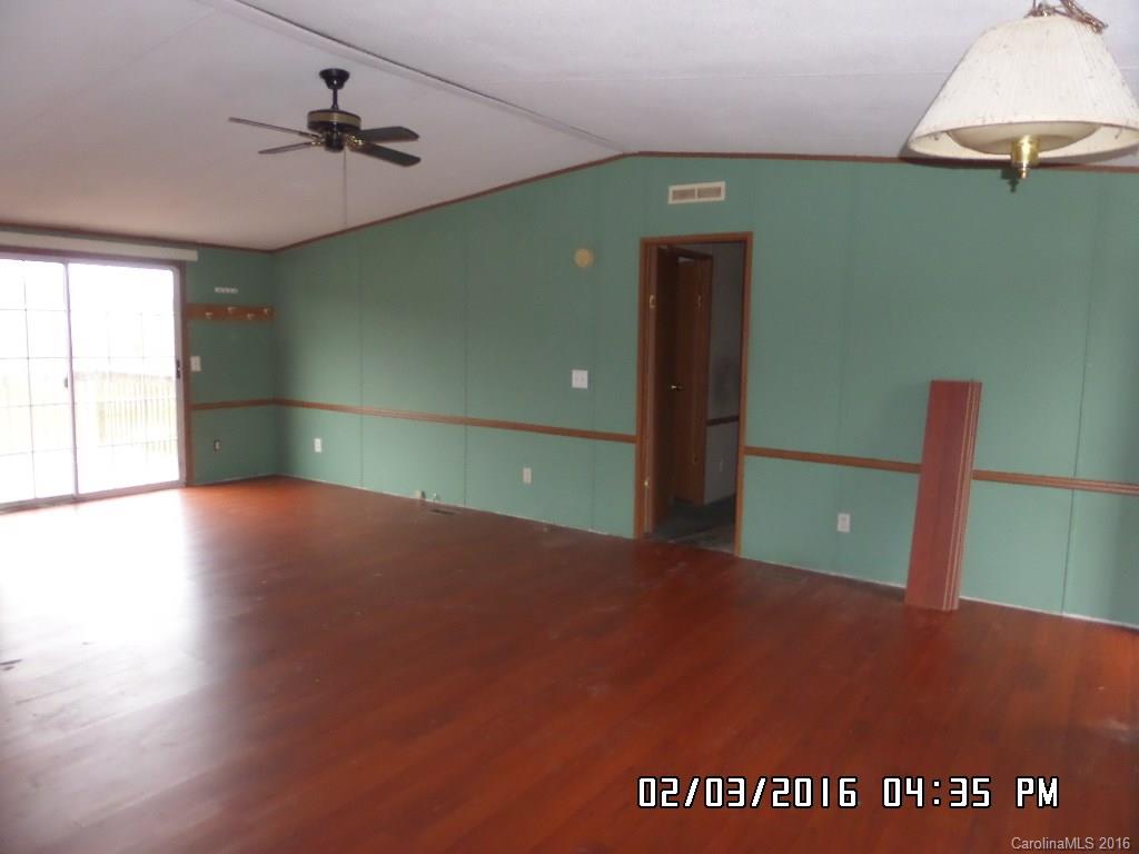 8480 Smith Road Kannapolis, NC 28081 - Photo 7 of 11 a view of a room with a ceiling fan and window