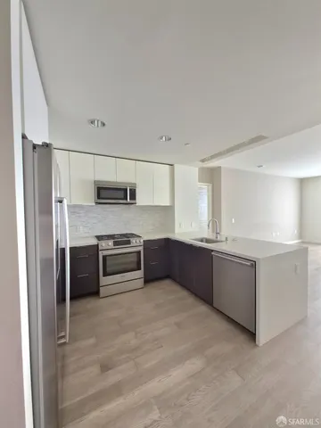 a view of a patio with dining table and chairs