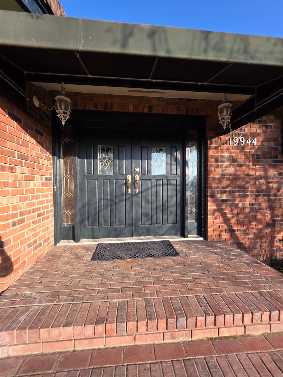 Undisclosed Address Lockeford, CA 95237 - Photo 1 of 1 a bedroom with a bed and a large window