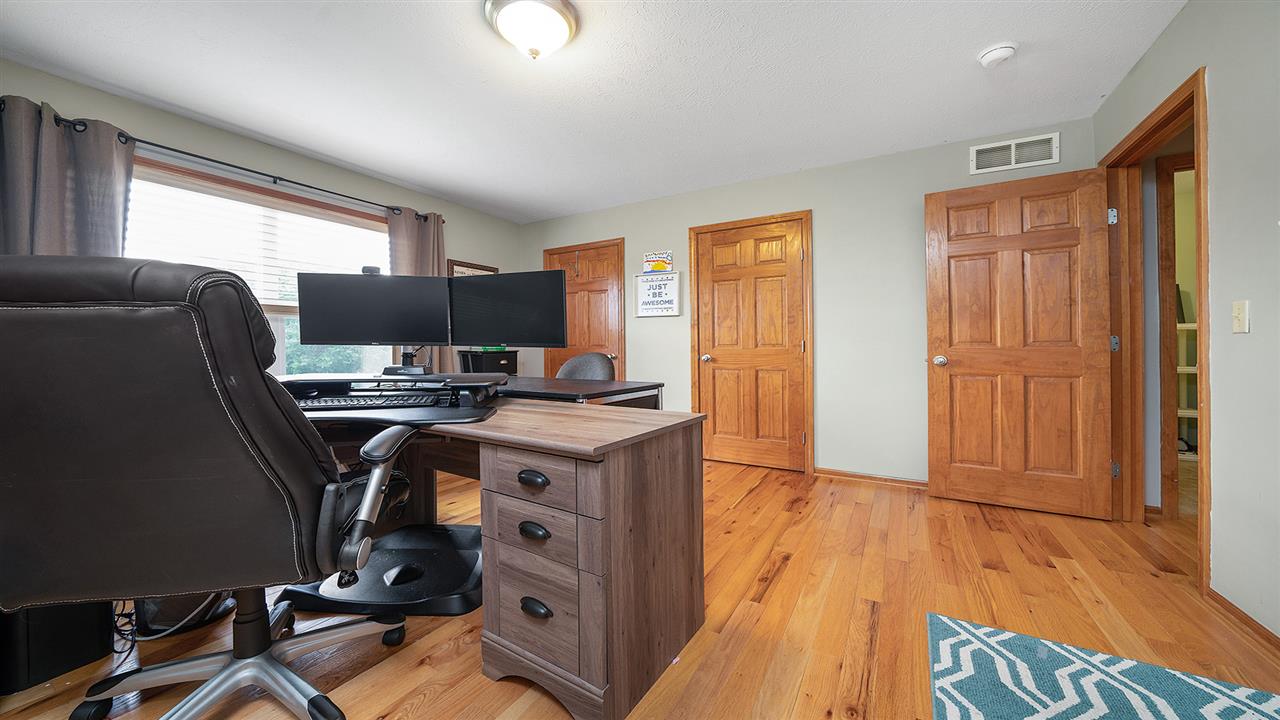 10997 Chicory Ridge Way Roscoe, IL 61073 - Photo 23 of 36 a view of workspace with wooden floor windows