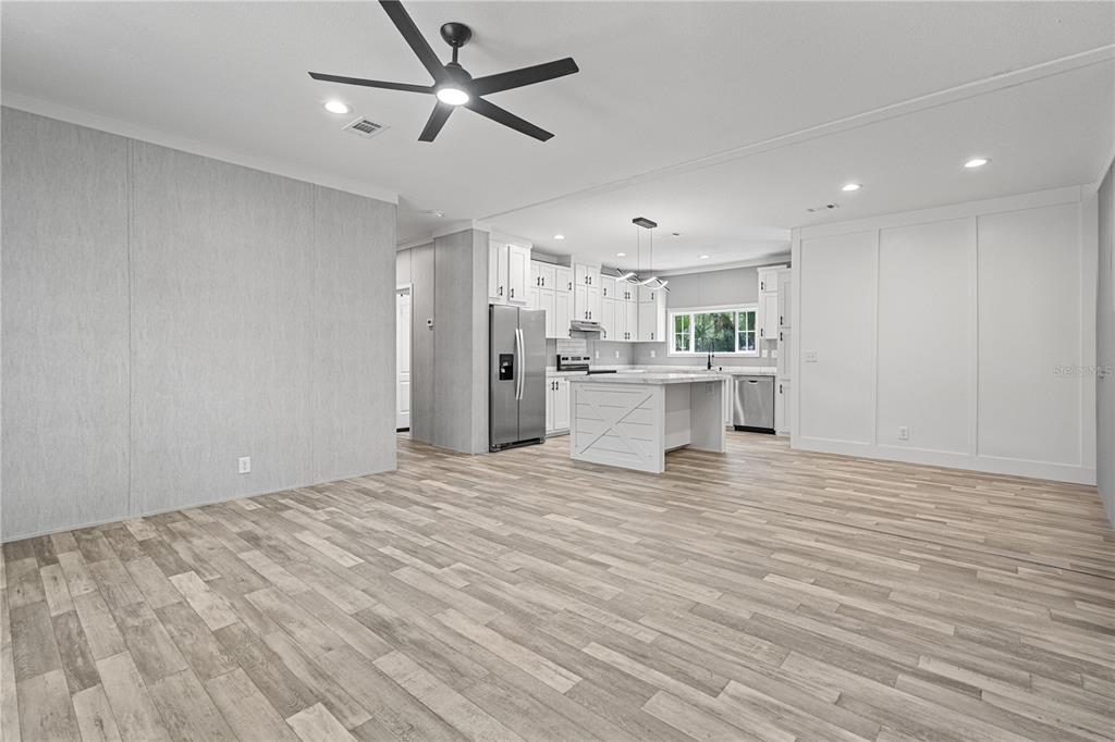 375 Sapp Street Inglis, FL 34449 - Photo 5 of 36 a view of a kitchen with a sink and a refrigerator