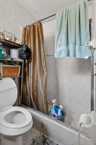 a bathroom with a toilet sink and tub