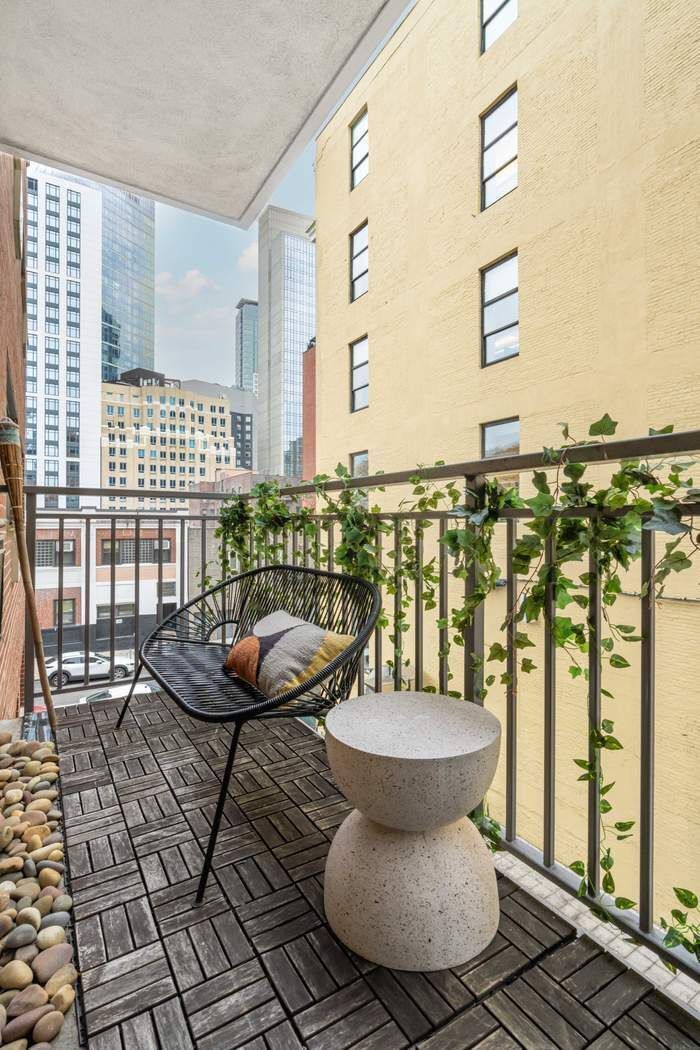 27-16 41st Avenue, Unit 3D Queens, NY 11101 - Photo 3 of 14 a bathroom with a sink mirror and a window