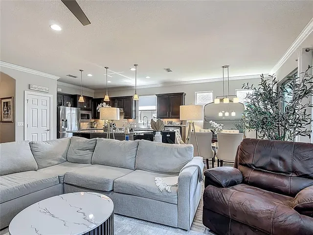 a bedroom with a large bed and a couch