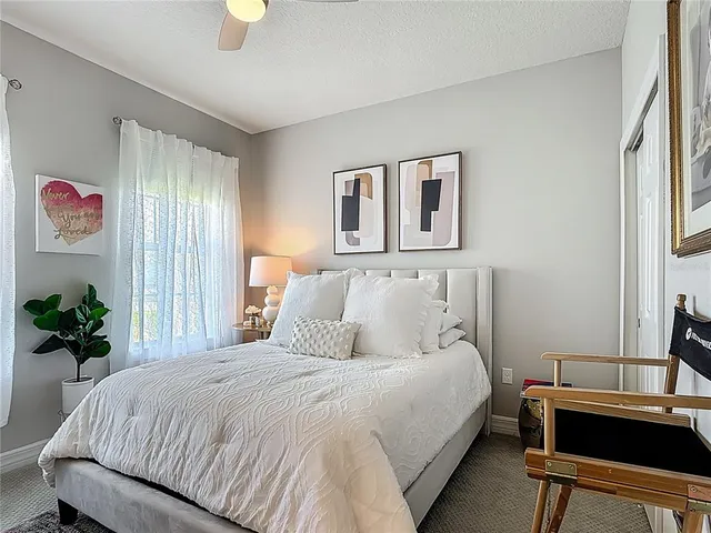 a bathroom with double vanity sinks a vanity a lamp and a mirror