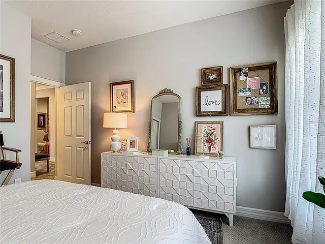 a view of a bedroom with a hardwood and hallway