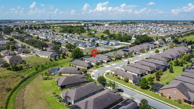 a living room with furniture and a mirror
