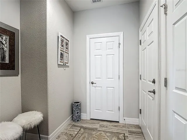a patio with a table and chairs