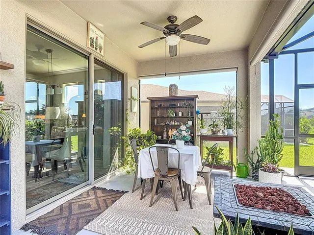 an aerial view of a residential houses with outdoor space and a lake view