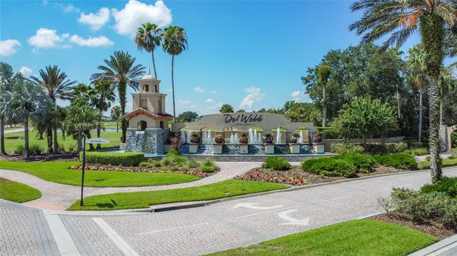 an aerial view of a house with swimming pool a yard and outdoor seating