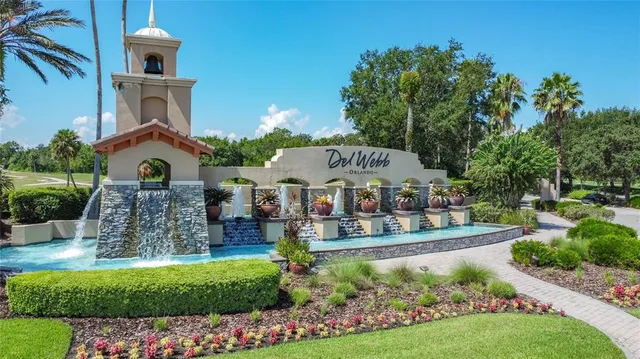 a view of a swimming pool with a yard and a wooden deck