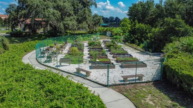 an aerial view of a house with a garden