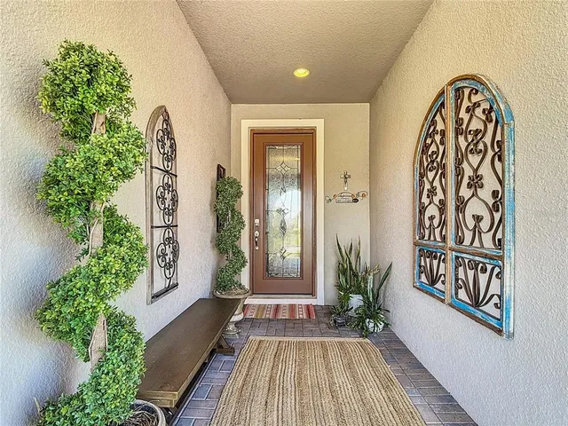 a kitchen with granite countertop a sink stove and refrigerator