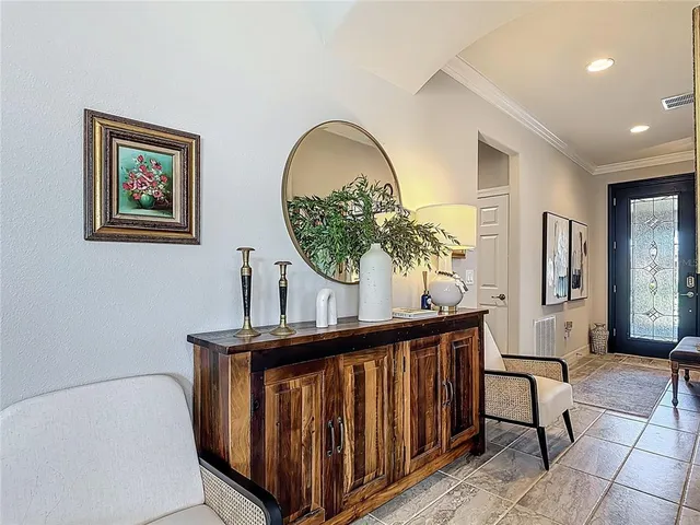 a dining room with furniture window and wooden floor