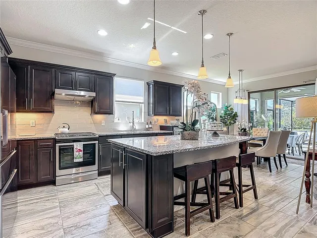 a view of a dining room with furniture window and outside view