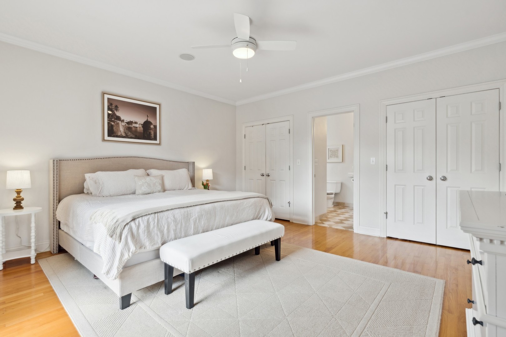 2147 West Rice Street, Unit 1W Chicago, IL 60622 - Photo 12 of 27 a spacious bedroom with a bed and a lamp
